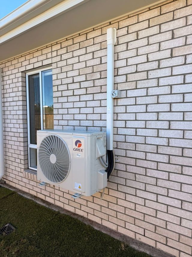 Outdoor air conditioning condenser unit installed by GTA Aircon and Electrical in Brisbane