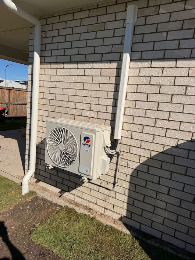 Outdoor air conditioning condenser unit installed by GTA Aircon and Electrical in Brisbane