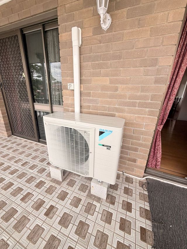 Outdoor air conditioning condenser unit installed by GTA Aircon and Electrical in Brisbane