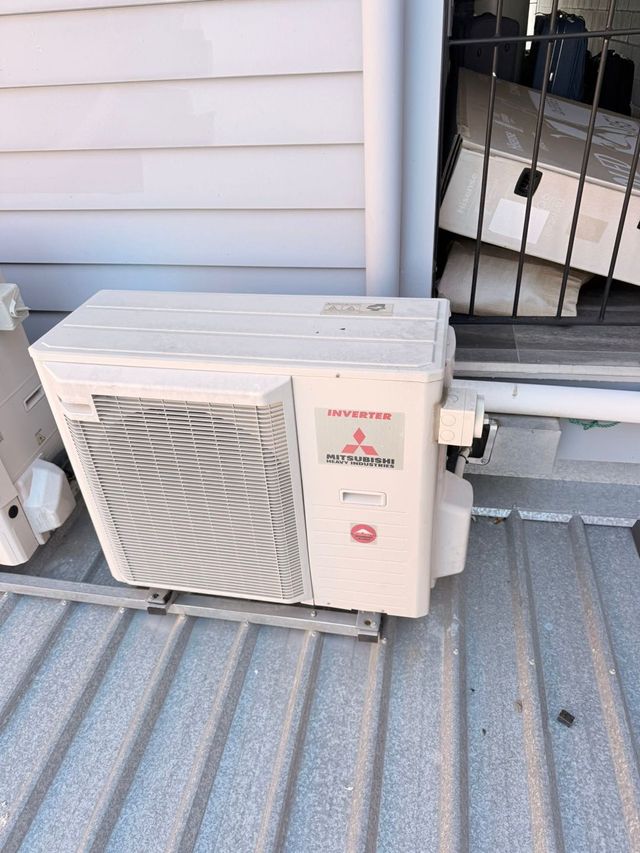 Outdoor air conditioning condenser unit installed by GTA Aircon and Electrical in Brisbane