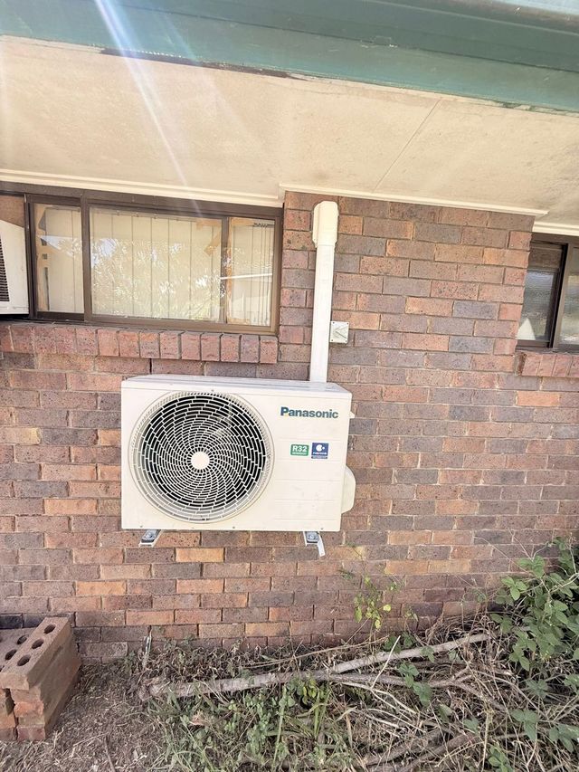 Outdoor air conditioning condenser unit installed by GTA Aircon and Electrical in Brisbane
