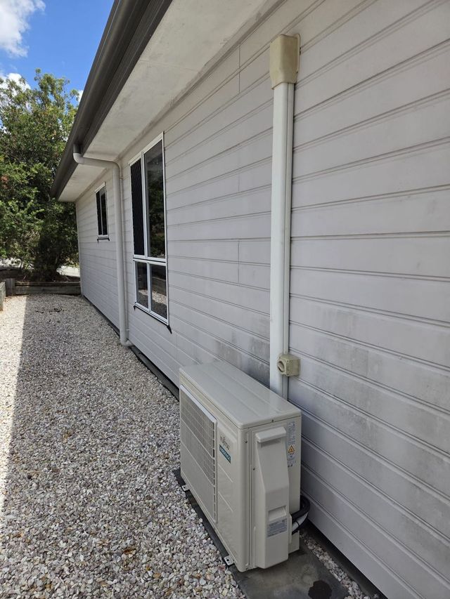 Outdoor air conditioning condenser unit installed by GTA Aircon and Electrical in Brisbane